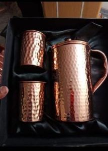 Copper water jug and glass