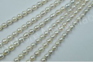 SOUTH SEA LONG SHAPE 8.5-9 MM WHITE COLOR PEARL BEADS