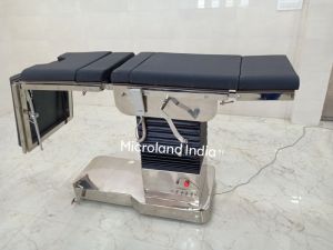 C-arm electro mechanical operated surgical table with remote and battery backup.