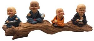 Sitting Little Monk On Wooden Platform