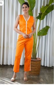 Sleeveless laced orange waist-coat with straight pants set