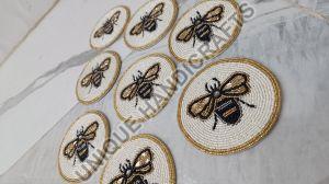 beaded coasters of bugs