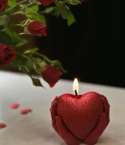 Heart in hands candle