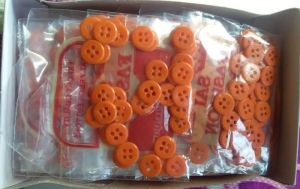 4 hole orange plastic round urea button