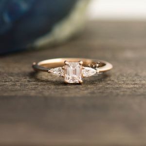 Unique Emerald and Pear Cut Three Diamond Engagement Ring