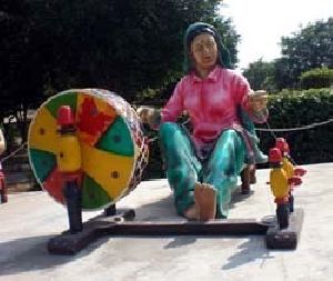 Punjabi Lady Spinning Yarn Charkha Statue
