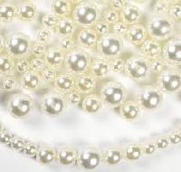 white plastic pearl beads