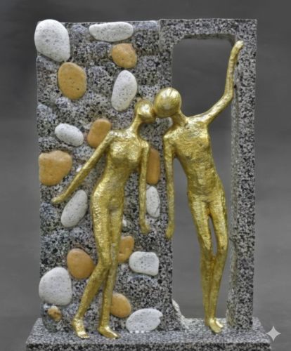 Gold Toned Human Figures Set within a Textured Stone Frame.