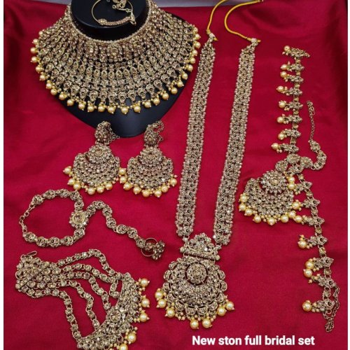 Gold-Toned Stone Studded Full Bridal Jewellery Set with Choker, Long Necklace, Earrings, Maang Tikka