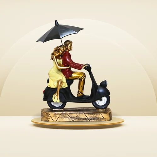 Romantic Couple on Scooter Statue