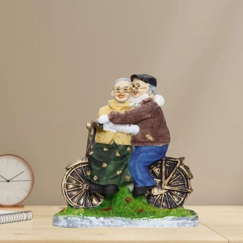 Romantic Dada Dadi Love Couple Statue On Cycle