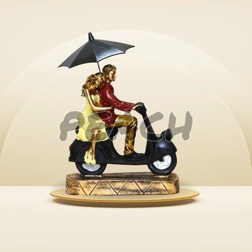 Romantic Couple on Scooter Statue