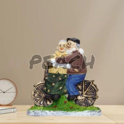Romantic Dada Dadi Love Couple Statue On Cycle
