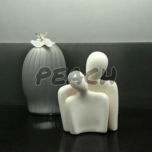 White Ceramic Couple Statue