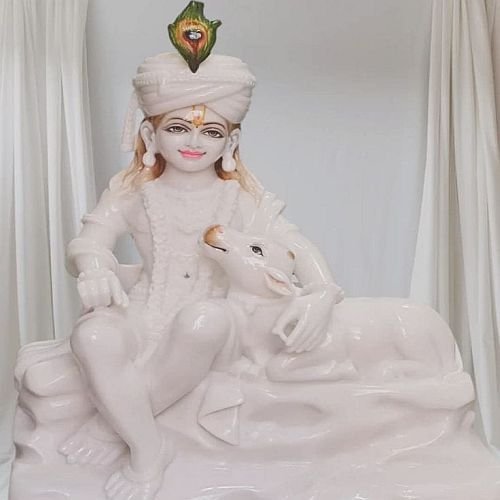 White Marble Sitting Krishna With Cow Statue