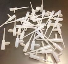 Plastic needles for adhesives