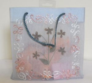 matching embroidery all over organza fabric bag