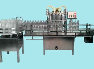 AUTOMATIC 4 HEAD BOTTLE FILLING MACHINE