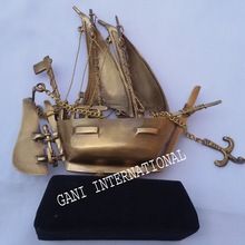 brass ship wooden base