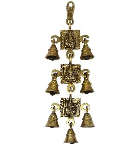 Brass Ganesh Laxmi and Saraswati Images with 7 Bells Wall Hanging