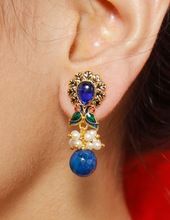 style with pearl drop earrings