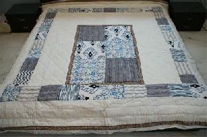 patch-block print bed-sheet quilt