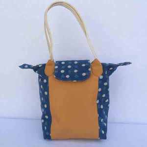 Light brown leather purse with batik printed cotton canvas