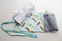 A WRAP BURP CLOTH WITH HEAT RETENTION BOTTLE POCKET