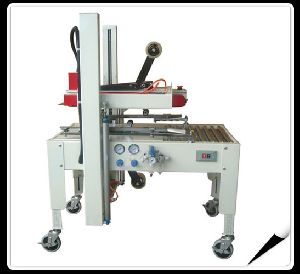 Pneumatic carton sealer machine