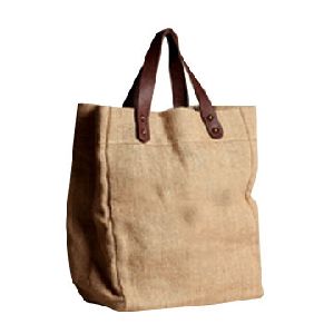 NATURAL JUTE BAG WITH REXINE HANDLE .