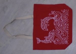 Dyed jute bag with white tape handle