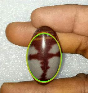 natural cross symbol made on narmadeshwar shivlinga