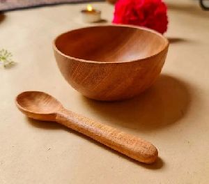 small wooden bowl with wooden baby spoon
