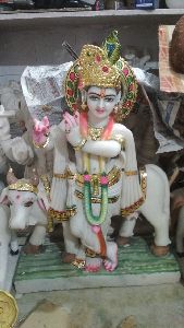 Stone statues lord cow krishna