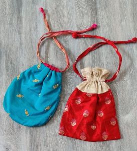 Silk potli bags, size and colour may be customised, wall decor of cross stitch, this may be customised too. The products can be acrylic framed an