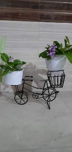 Two tire Iron bicycle planter stand with pot