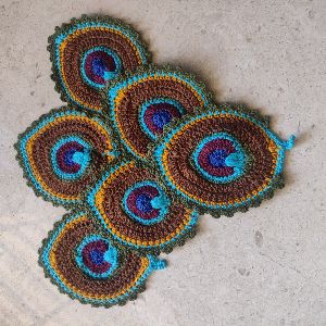 Crochet peacock tea coaster