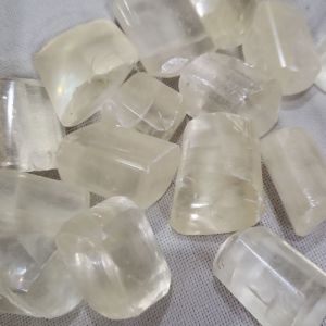 Clear calcite gemstone tumbles