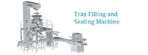 Tray filling and sealing machine