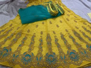 Ladies Yellow Fancy Net Lehenga Choli