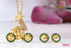 Gold AD green stone cycle pendant set