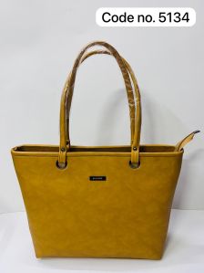 Ladies Plain Yellow Handbag