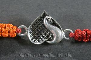 Vibrant Heart Shape Peacock Design Intricate Silver Rakhi