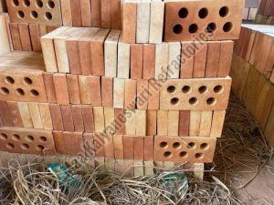 Perforated refractory fire bricks