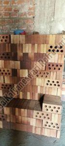 Perforated refractory fire bricks