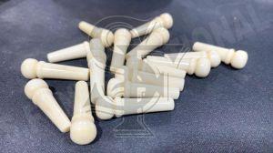 White bleached Bone Bridge Pins