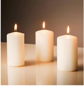 white round pillar candle