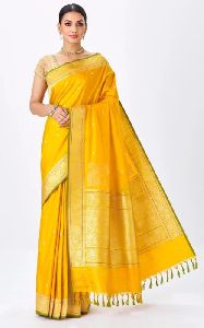 Mustard Handwoven Banarasi Silk Saree With Floral Motifs & Corner Buttas