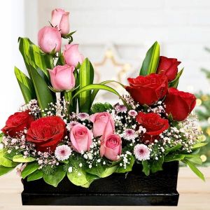 Red and Pink Rose Floral Arrangement in Black Vase