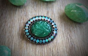 emerald gemstone brooch